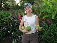 IMG_0746 Ruth holds our first grapefruit harvest (3 of them) and a passion fruit (the small one).