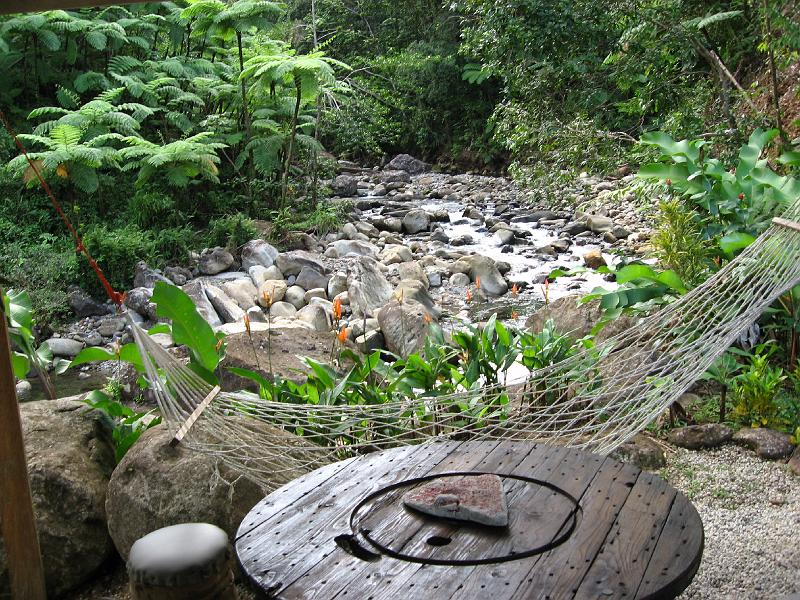 IMG_0825 A cabin's patio overlooks a stream.