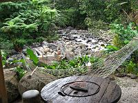 IMG_0825 A cabin's patio overlooks a stream.