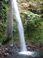 IMG_0864 A tourist enjoys the second fall's massage. The force of the water from about an 86-foot drop is just bearable to stand under.
