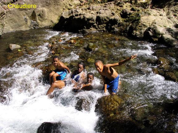 chaudiere-2 The boy 2nd from the right is Trever Charles, from Bense. His father, Tony Charles, is friend of ours.  Then, he ownd and operated one of the neatest tourist busses in Dominica. Now he has an auto sales and taxi business. In 2006, he arranged our car purchase for us, and got us a peach.