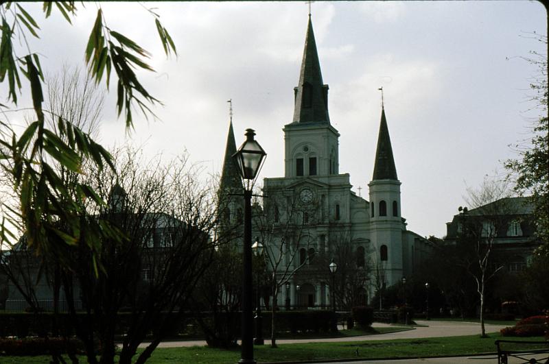 quarter-35 St. Louis Cathedral from across Jackson Square. Cathedral of Saint Louis King of France, A Minor Basilica established as a Parish in 1720 in New Orleans, Louisiana. It was built between 1789 and 1794.  The Cabildo stands on its left and the Presbytere on its right; the three buildings face the Mississippi River.  Bounding Jackson Square on the right and left just out of the picture are the Pontalba Mansions. The Lousiana Purchase was signed in the Cabildo. Twenty-one years later, in 1994 Ruth and I would return as guests for the wedding of Harry Connick Jr. and Jill Goodacre in St. Louis Cathedral.
