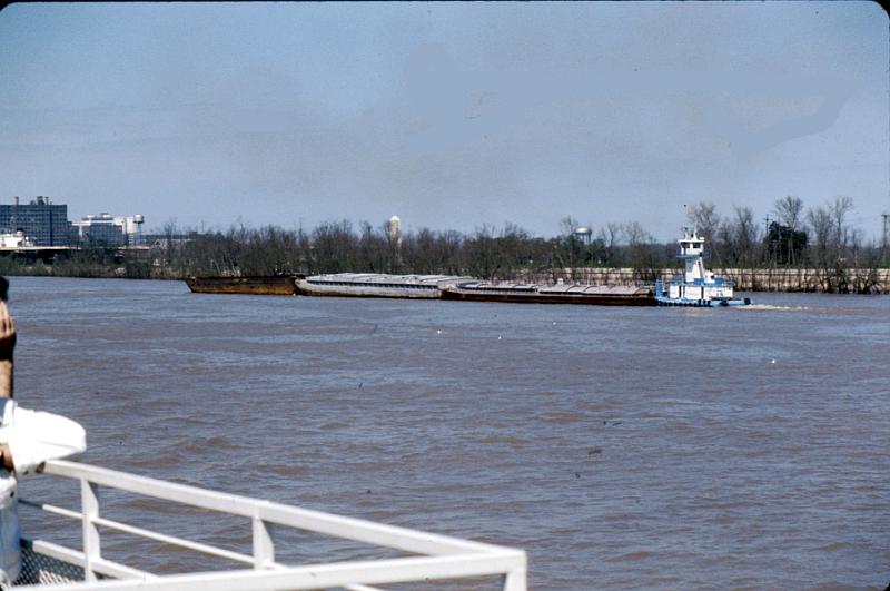 river-14 A tug pushes barges up-river.
