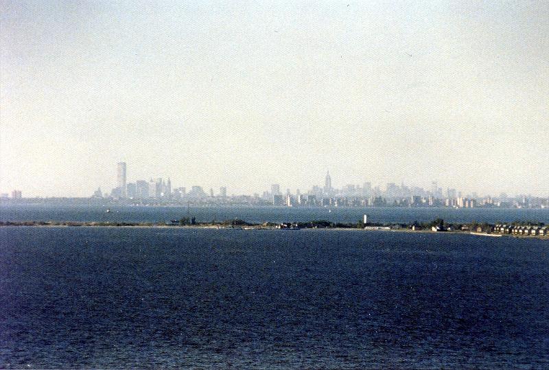 05 New York City skyline (pre 9/11/2001) viewed from Atlantic Highlands NJ.  Sandy Hook NJ, now part of Gateway National Recreation Area, which is located in both NY and NJ and includes the Statue of Liberty and Ellis Island.  The tallest buildings on the left are the World Trade Towers, and the tall one just to the right of the center is the Empire State Building. (From Wikipedia: The Empire State Building is a 102-story Art Deco skyscraper in New York City. Its name is derived from the nickname for the state of New York. It stood as the world's tallest building for more than forty years, from its completion in 1931 until the construction of the World Trade Center North Tower in 1972, and is now once again the tallest building in New York after the destruction of the World Trade Center on September 11, 2001. The Empire State Building has been named by the American Society of Civil Engineers as one of the Seven Wonders of the Modern World.)