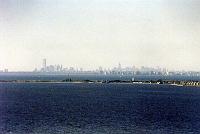 05 New York City skyline (pre 9/11/2001) viewed from Atlantic Highlands NJ.  Sandy Hook NJ, now part of Gateway National Recreation Area, which is located in both NY and NJ and includes the Statue of Liberty and Ellis Island.  The tallest buildings on the left are the World Trade Towers, and the tall one just to the right of the center is the Empire State Building. (From Wikipedia: a 102-story Art Deco skyscraper in New York City. Its name is derived from the nickname for the state of New York. It stood as the world's tallest building for more than forty years, from its completion in 1931 until the construction of the World Trade Center North Tower in 1972, and is now once again the tallest building in New York after the destruction of the World Trade Center on September 11, 2001. The Empire State Building has been named by the American Society of Civil Engineers as one of the Seven Wonders of the Modern World.)