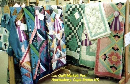 1-quilts Nova Scotia Quilts: Ruth is an avid quilter, and she took these photos of Nova Scotia Quilts. She also examined the quilts handmade by one elderly, relatively poor, lady selling them from her home along the Evangeline Trail. But while it was easy to look and walk away without purchasing anything at a store, and no purchase was possible at a museum, she felt so bad about walking away from the lady quilter in person that she made no more such visits! The photos are of quilts in a store (made by Nova Scotia quilters; the store sells them on consignment), at a museum and in our rooms at some bed and breakfasts.