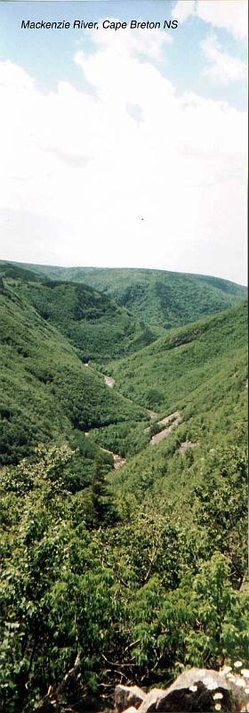 22-mackenzieriver The Mackenzie river flows through a cleft, possibly a fault line, between mountains in Cape Breton National Park.