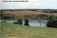 9-darlinglake Along the Evangeline Trail, Nova Scotia: We passed by Darling Lake, just north of Yarmouth, on our way to the ferry. The lake is a beautiful pastoral scene. Please forgive my mislabeling the photos. Darling Lake is not in the Annapolis Valley.