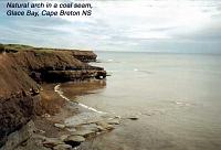 glacebay Glace Bay, Cape Breton, Nova Scotia: Glace Bay is located on a seam of soft coal that, if followed, would run from New Brunswick, under the Bay of Fundy, beneath the Nova Scotia peninsula and island of Cape Breton (where it surfaces at Glace Bay, near Sydney Mines, at the northeastern end of the island, and then contunues under the bed of Saint Lawrence Bay all the way to Newfoundland, 12 hours away by ferry. Notice the natural arch the waves have carved through the coal seam.