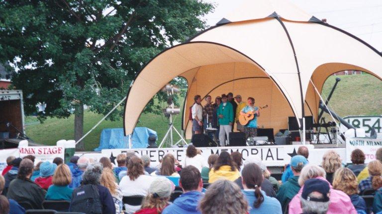 dan-lavin1 One attraction was the North Atlantic Folk Festival. Christine Lavin was the top-billed artist. I'm on stage with her. (Green Jacket, next to Christine, holding harmonica.
