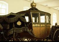 country_travel_coach Ceremonial State Carriage built in Paris around 1805 for Napoleon's coronation when he was made King of Italy.  What looks like wood was thin gold plating.  Later the gold was removed, and then the wood was bronzed for coronation ceremonies in Budapest in 1916.